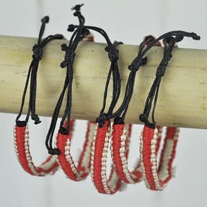 Red and natural bangle with shell cross
