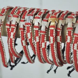 Red and natural bangle with shell cross